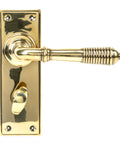 From The Anvil's Aged Brass Reeded Lever Bathroom Set