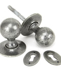 From The Anvil's Pewter Patina Round Mortice/Rim Knob Set