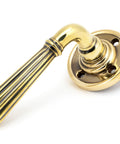 From The Anvil's Aged Brass Hinton Lever on Rose Set (Sprung)