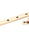 From The Anvil's Polished Bronze Hinton Stay