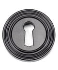 From The Anvil's Black Round Escutcheon