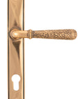 From The Anvil's Polished Bronze Hammered Newbury Slimline Espag. Lock Set
