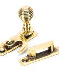 From The Anvil's Aged Brass Beehive Sash Hook Fastener