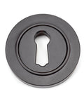 From The Anvil's Aged Bronze Round Escutcheon