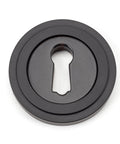 From The Anvil's Aged Bronze Round Escutcheon