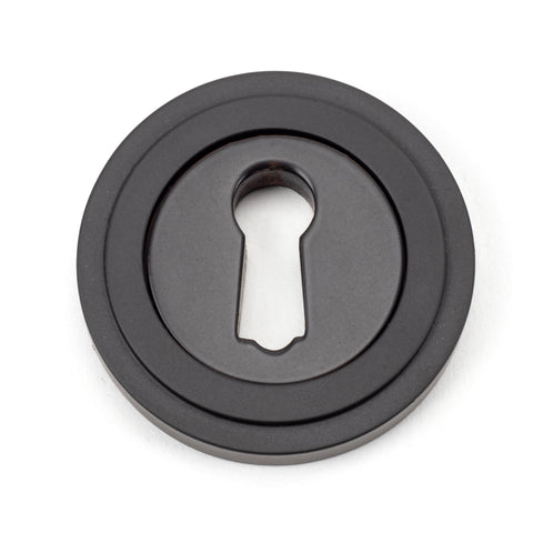 From The Anvil's Aged Bronze Round Escutcheon
