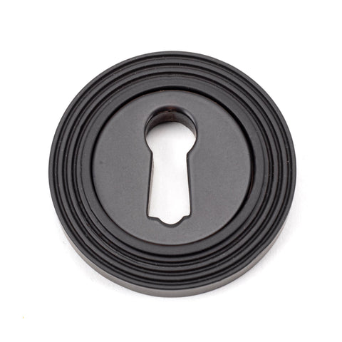 From The Anvil's Aged Bronze Round Escutcheon