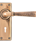 From The Anvil's Polished Bronze Hammered Newbury Lever Lock Set
