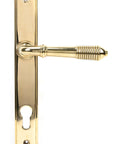 From The Anvil's Polished Brass Reeded Slimline Lever Espag. Lock Set