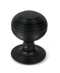 From The Anvil's Matt Black Beehive Centre Door Knob