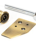 From The Anvil's Aged Brass Key-Flush Sash Stop