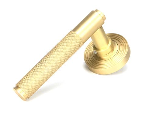 From The Anvil's Satin Brass Brompton Lever on Rose Set (Sprung)
