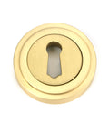 From The Anvil's Satin Brass Round Escutcheon