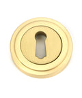 From The Anvil's Satin Brass Round Escutcheon