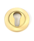 From The Anvil's Satin Brass Round Euro Escutcheon