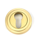 From The Anvil's Satin Brass Round Euro Escutcheon