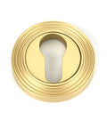 From The Anvil's Satin Brass Round Euro Escutcheon