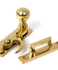 From The Anvil's Polished Brass Sash Hook Fastener