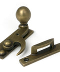 From The Anvil's Burnished Brass Sash Hook Fastener