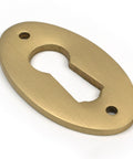 From The Anvil's Satin Brass Oval Escutcheon