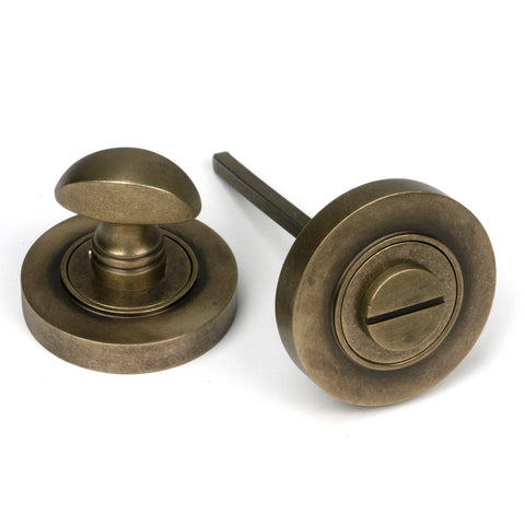 From The Anvil's Burnished Brass Concealed Round Thumbturn Set