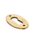 From The Anvil's Aged Brass Oval Escutcheon