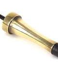 From The Anvil's Aged Brass Projection Door Stop