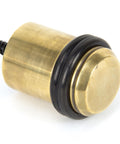 From The Anvil's Aged Brass Floor Mounted Door Stop