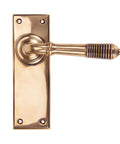From The Anvil's Polished Bronze Reeded Lever Latch Set